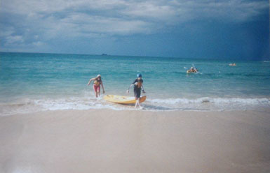Bev did not boogie-board on the Gold Coast, but she did
some ocean kayaking; this is her taking up the stern